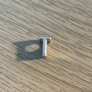 Silver T charm
